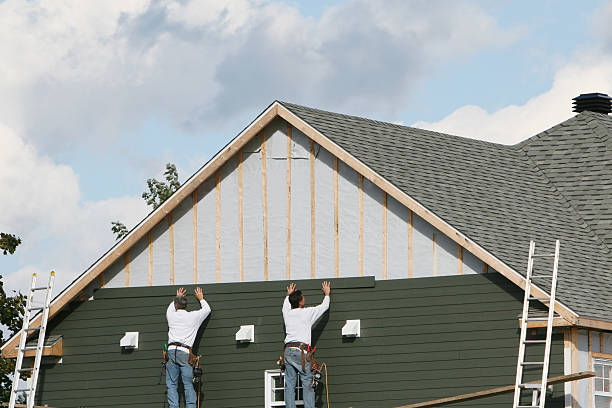 Professional Siding Contractor technician working in Manor, TX